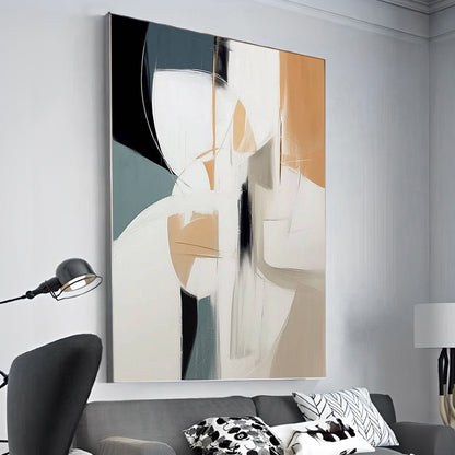 Abstract art painting on a wall above a sofa in a living room