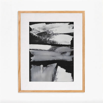 Abstract black and white painting in a wooden frame on a white background