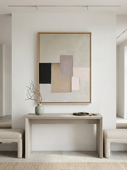 Modern interior with a Neutral Abstract Block Painting Framed with Oak Floater Frame from Noho Art Gallery on a wall above a table.