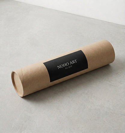 Kraft paper roll with a black label on a light gray surface . Noho Art Gallery