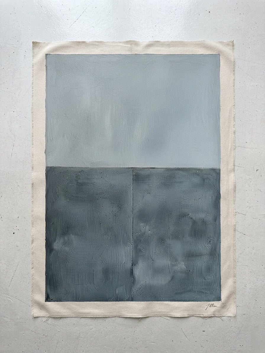 An Premium blue gray textured abstract wall art for living room décor by Noho Art Gallery on textured off-white paper with a wide cream border, featuring a light gray upper half and a dark charcoal-gray lower half, displayed against a neutral light gray wall.