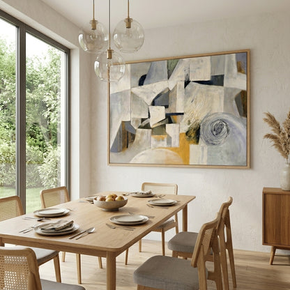 Dining room with wooden table, chairs, Large Neutral Abstract Wall Art Painting framed artwork by Noho Art Gallery for modern minimalist interiors on the wall, and large window.