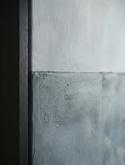 Close-up of a Thick texture blue gray canvas artwork for modern interior design by Noho Art Gallery or panel with a horizontal seam, showing painted plaster-like surfaces in soft gray and white tones.