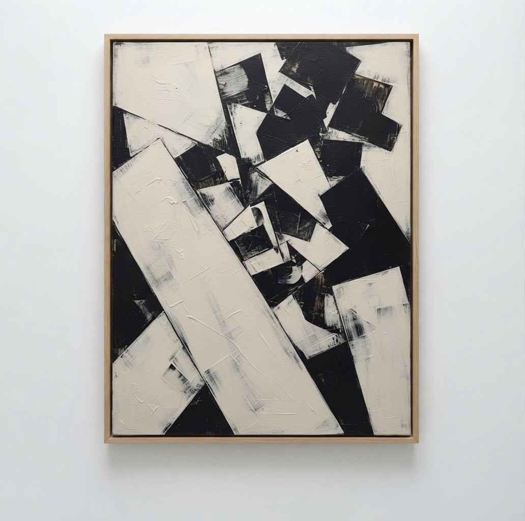 An Textured neutral abstract canvas art for a stylish modern living room by Noho Art Gallery featuring bold black and off-white geometric shapes with thick textured brushstrokes, mounted on a clean white wall.