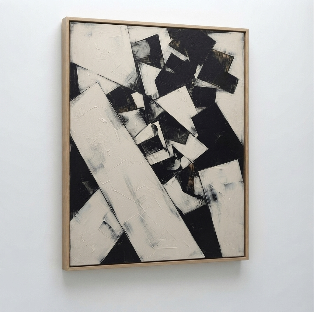 An High contrast modern abstract art with bold black and white composition by Noho Art Gallery framed painting featuring bold black and off-white geometric shapes, hung on a plain white wall.