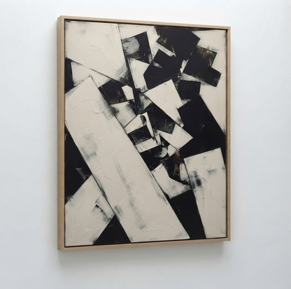 An High contrast modern abstract art with bold black and white composition by Noho Art Gallery framed painting featuring bold black and off-white geometric shapes, hung on a plain white wall.