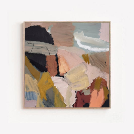 Original abstract oil painting, large textured abstract canvas art, handmade impasto abstract painting, abstract art with earth tones with textured brushstrokes in muted beige, brown, black, yellow, pink, and gray tones, hung on a plain white wall.