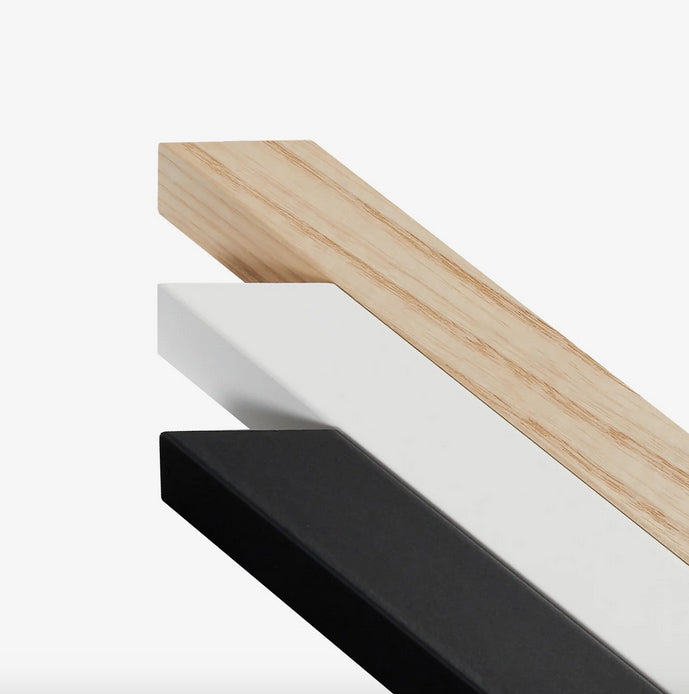 Three shelves in black, white, and wood on a white background