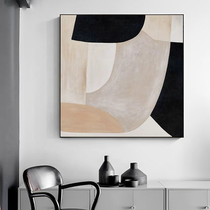 Abstract art piece on a wall with a chair and cabinet below.