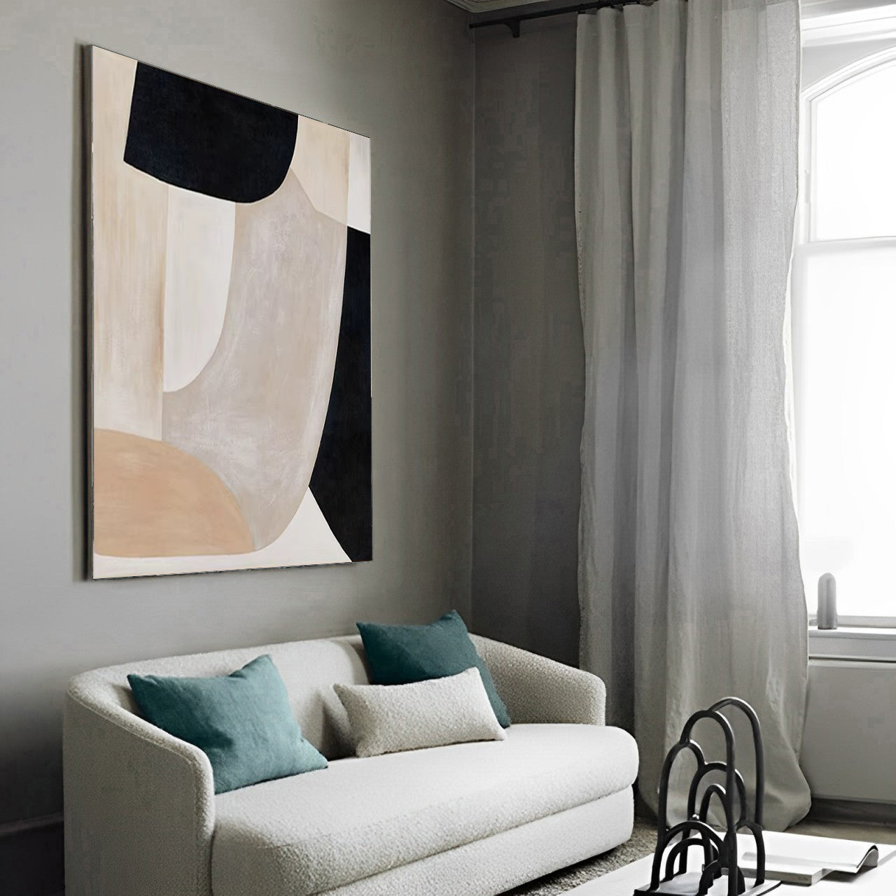Modern living room with a white sofa, abstract art, and large window.