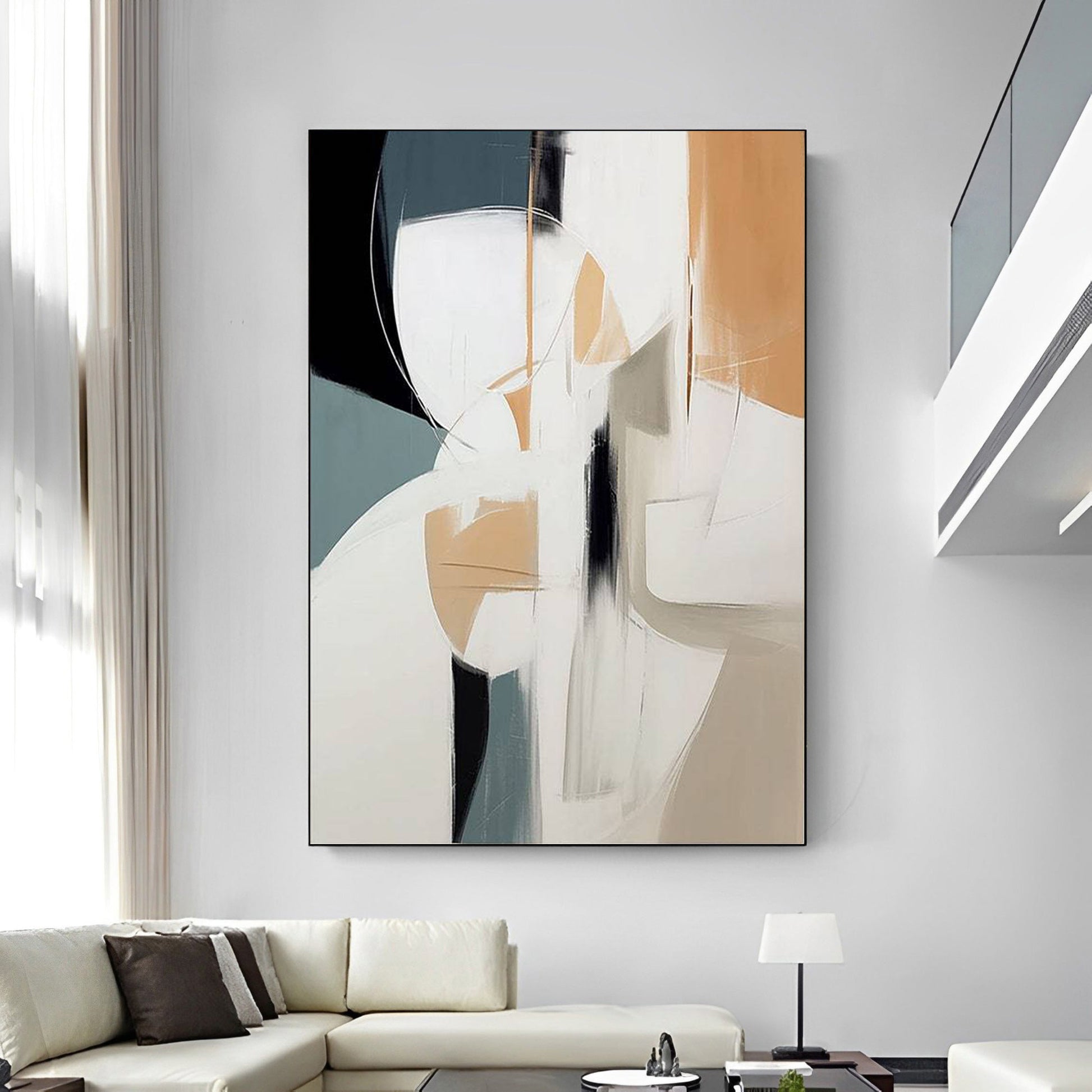 Abstract art painting on a wall above a sofa in a modern living room.